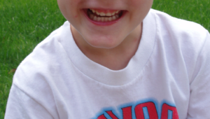Photo of a young boy's smile.
